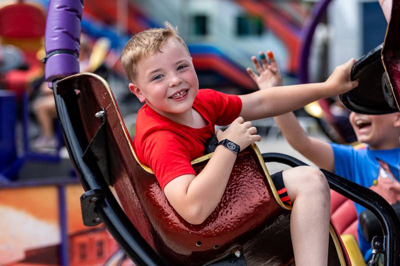Homer Glen resident Declan McDonald rides the Tornado during Old Canal Days in Lockport on June, 7, 2025.