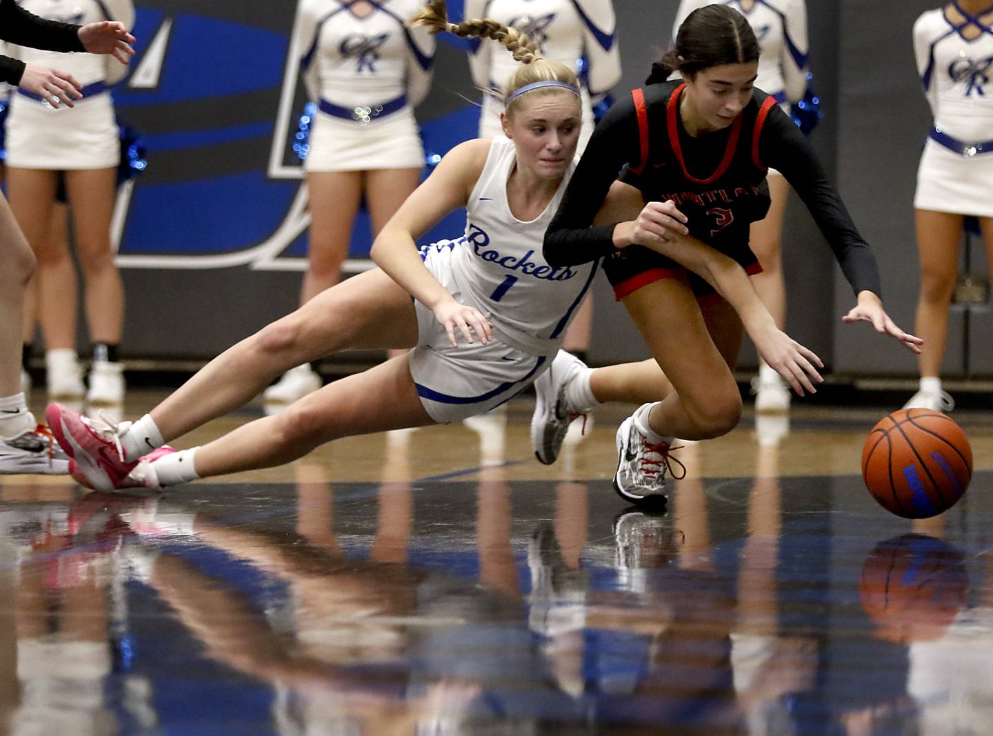 Huntley's Cassidy Serpe beats Burlington Central's Kenzie Andersen to a loose ball during a Fox Valley Conference girls basketball game on Friday, Dec. 15, 2023, at Burlington Central High School.