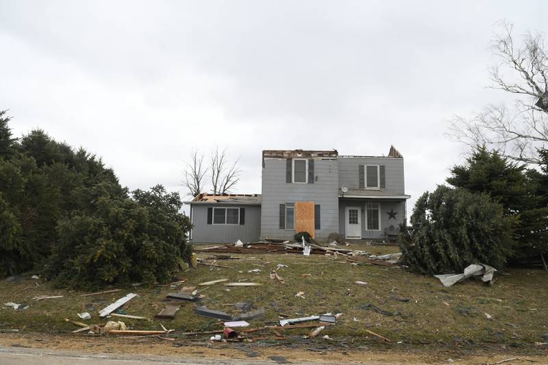 This home across Illinois 64 from Lanark Family Farms had its roof torn off sheds during Friday's storm east of Lanark.