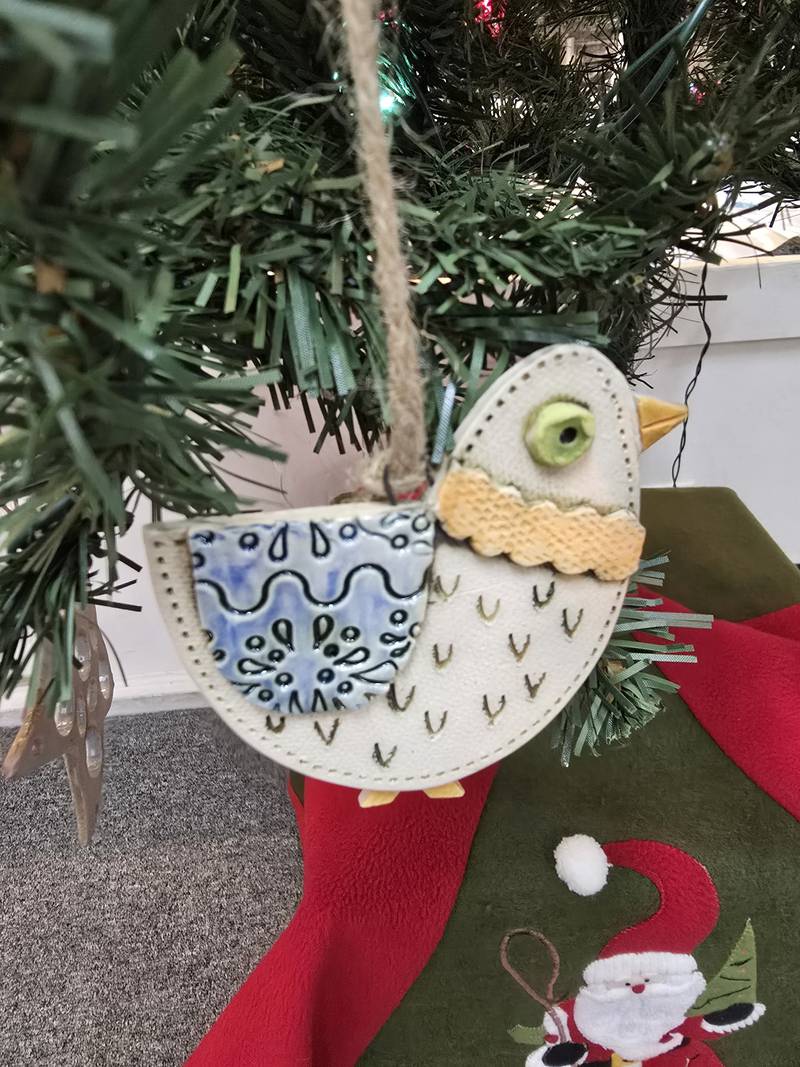 Janell Mayer has handcrafted ornaments and some holiday "uggles" for sale at the Artisans on Main in Woodstock.