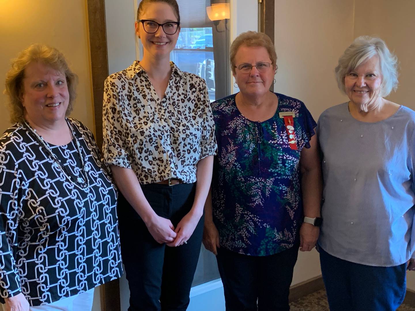 Ann Frels, recording secretary; Kelly Kessel, president; Lynn Weber, vice-president; Pat Wiggim, Treasurer.
