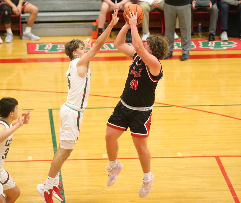 Hall's Payton Dye sinks a three point shot over L-P's Seth Adams on Tuesday, Nov., 28, 2023 in AJ Sellett Gymnasium at L-P High School.