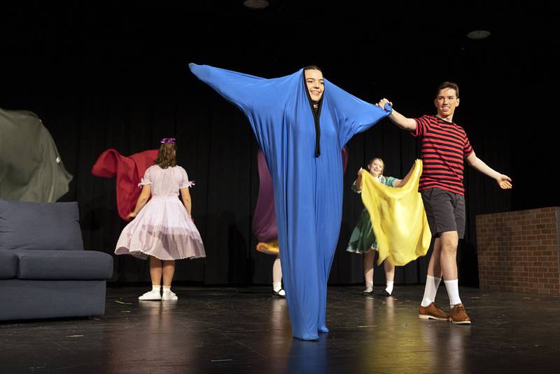 Hannah Britt, playing the part of Linus’ blanket, dances with Ryan Welty, during a scene Tuesday, March 7, 2023. Performances will be March 9, 10 and 11 at 7 pm and March 12 at 2 pm at the Jerry Mathis Theatre at Sauk Valley College.