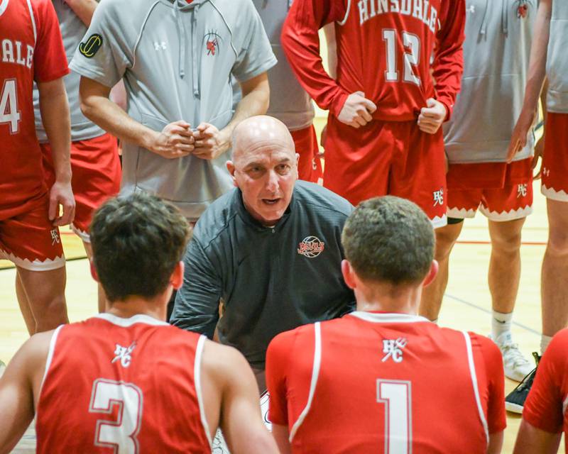 Hinsdale Central's head coach Jason Ziemer talks to the team during a timeout in the game on Saturday Jan. 24, 2026, while traveling to take on Batavia High School.