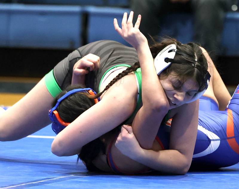 Rock Falls’  Ashlyn Fargher works to pin Genoa-Kingston's Dulce Ibarra Thursday, Jan. 16, 2025, during their 144 pound match at Genoa-Kingston High School.