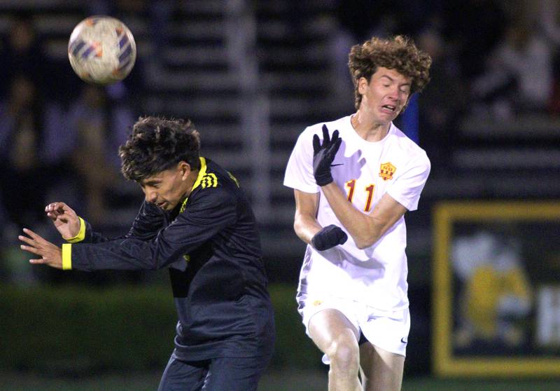 Harvard’s Jesus Aquino, left, battles Richmond-Burton’s Jack Meyer for the ball in varsity soccer on Monday, Oct. 7, 2024, at Dan Horne Field on the campus of Harvard High School in Harvard.