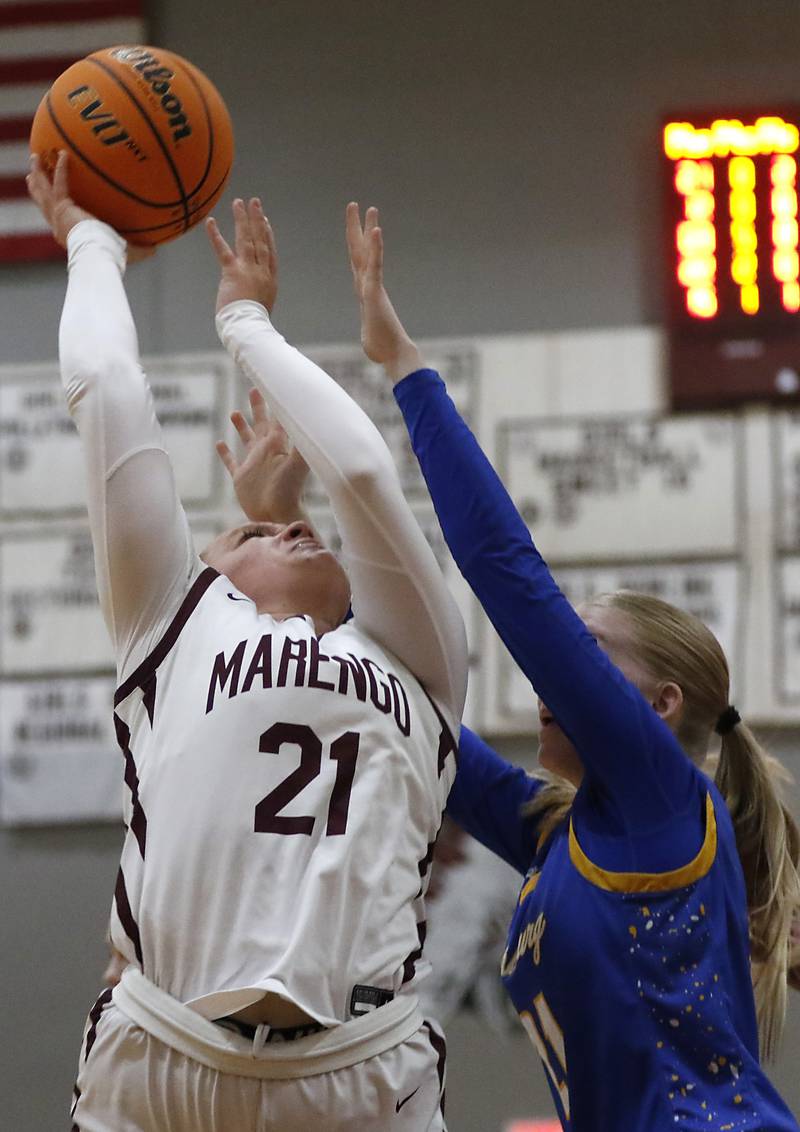 Marengo's Mia Feidt shoots the ball over Johnsburg's Carlie Majercik during a Kishwaukee River Conference basketball game on Saturday, Feb. 1, 2025, at Marengo High School.