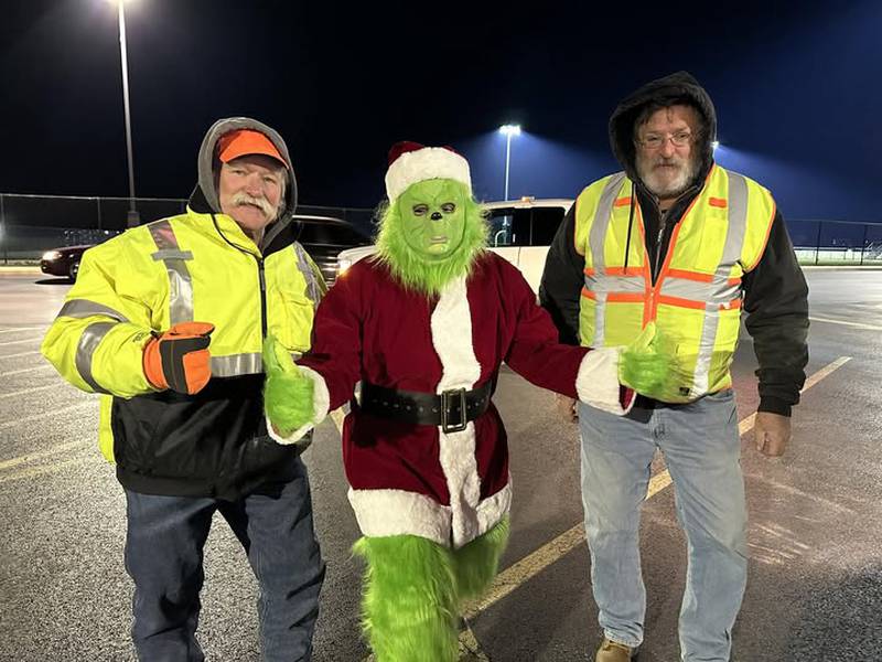 Pictured are Open Roads ABATE members Cliff Oleson and Bruce Littlebrant with The Grinch at Plano High School. Not pictured are Cindy Bennish and Sam Mataya. Open Road ABATE members assisted in the Plano Rockin’ Christmas event and parade.
