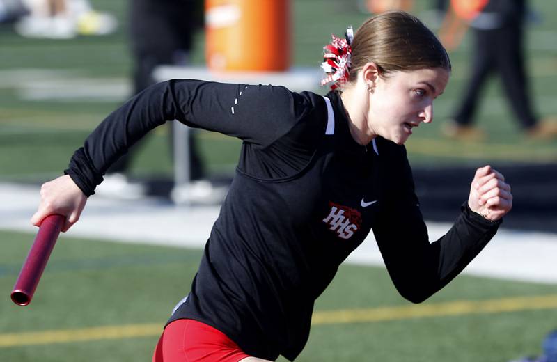 Huntley’s Rachel Hogan runs the first leg of the 4x100 meter relay  on Thursday, May 7, 2026, during the Fox Valley Conference Girls Track and Field Meet at Huntley High School.