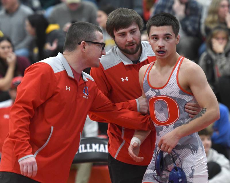 Oregon coaches Justin Laham and Noah Paul talk to Josiah Perez after he won a decision over Lena-Winslow's Keller Otto in the 120-pound championship match at the 1A Stillman Valley Sectional on Saturday, Jan. 31, 2026 at Stillman Valley High School.