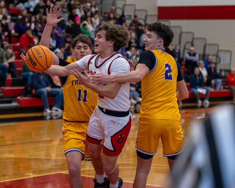 Greyson Bickett (0) of Hall attempts to lay up ball but Drew Becker (2) of Mendota fouls him leading to Bickett's miss on Saturday, December 20, 2025 at Hall High School in Spring Valley.