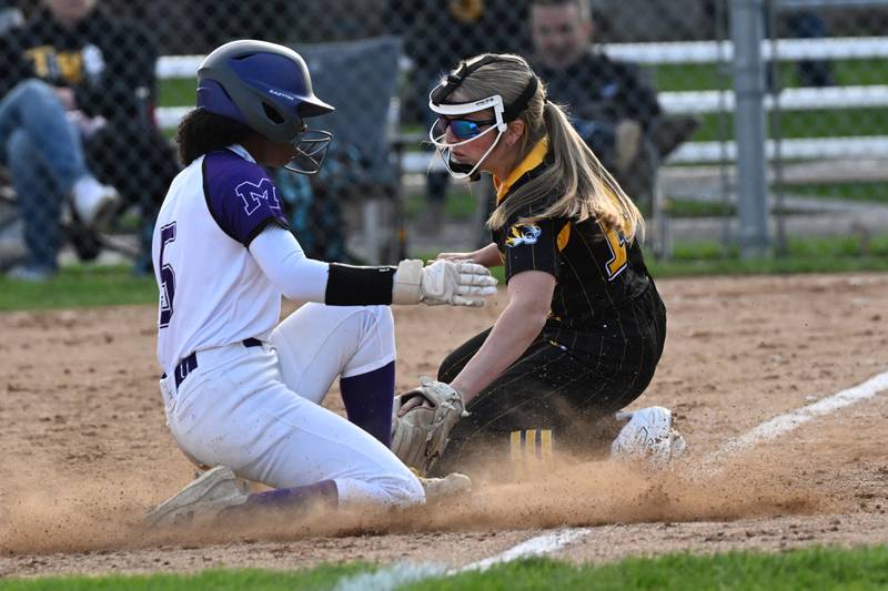 Herscher's Addy Whitaker places a tag on Manteno's Amiya Carlile during the Tigers' 4-1 loss to Manteno on Monday, May 5, 2025.