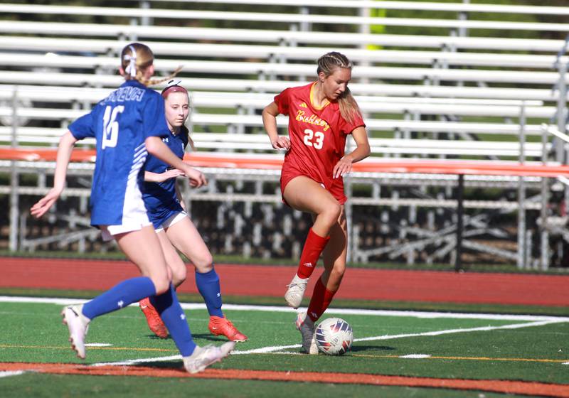 Batavia's Hannah Hickman dribbles the ball during a Tri-Cities Soccer Night game against Geneva on Tuesday, April 29, 2025 at St. Charles East.
