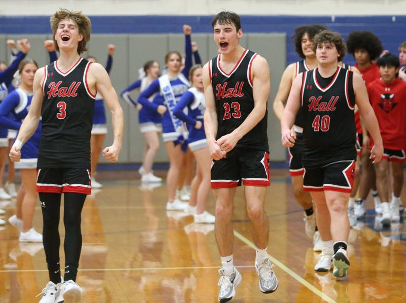 Hall's Max Bryant, Braden Curran and Payton Dye react after defeating Princeton 67-63 on Friday, Jan. 26, 2024 at Princeton High School.