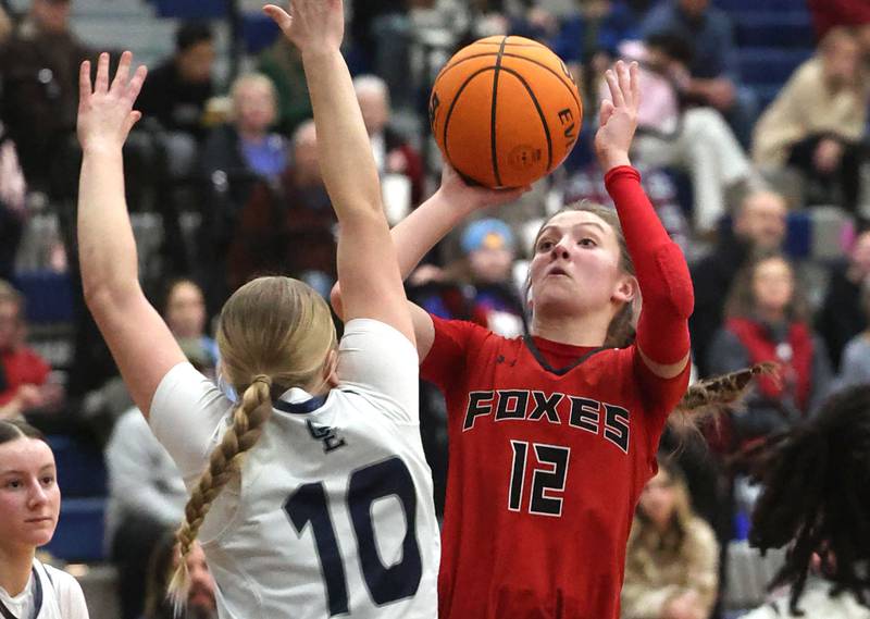 Yorkville's Elaine Gussman shoots over Oswego East's Samantha Herrick during their game Tuesday, Feb. 11, 2025, at Oswego East High School.