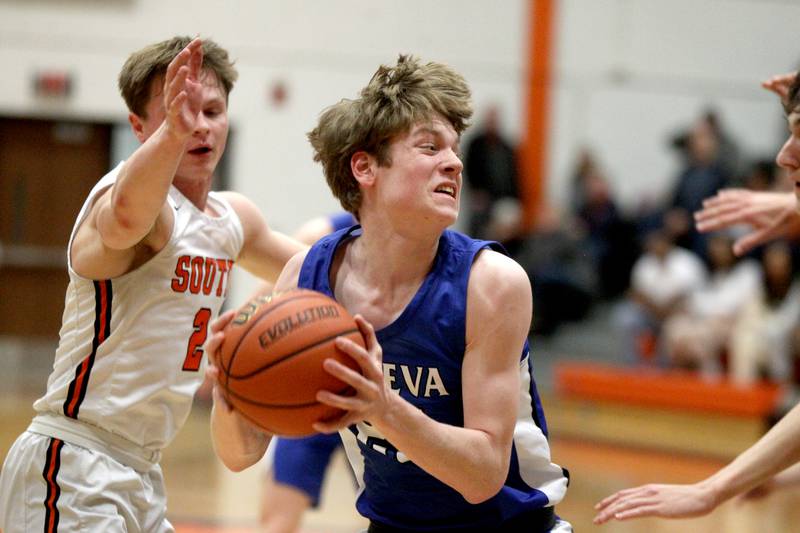 Geneva’s Hudson Kirby looks for an opening during a game at Wheaton Warrenville South on Friday, Jan. 27, 2023.