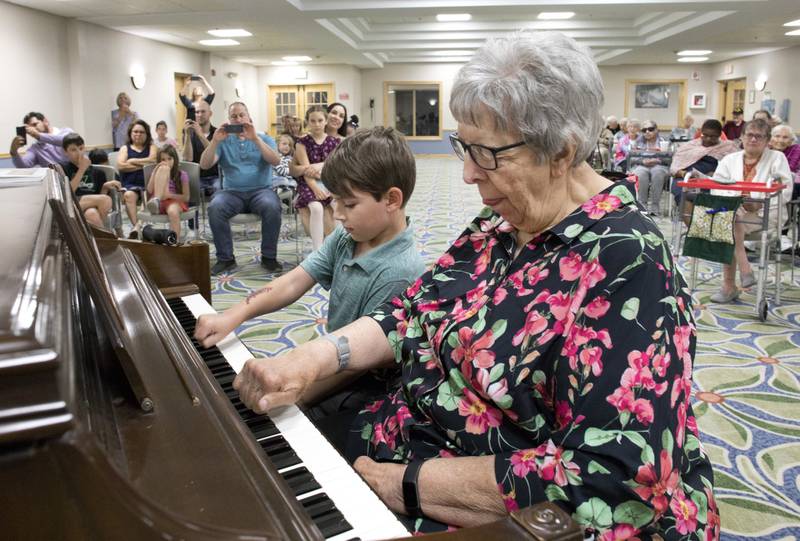 Timbers of Sorewood resident Paula Polechla and Hank Vasel, 6, perform together during a recital at Timbers of Shorewood Sunday, June 4, 2023, in Shorewood, Ill.