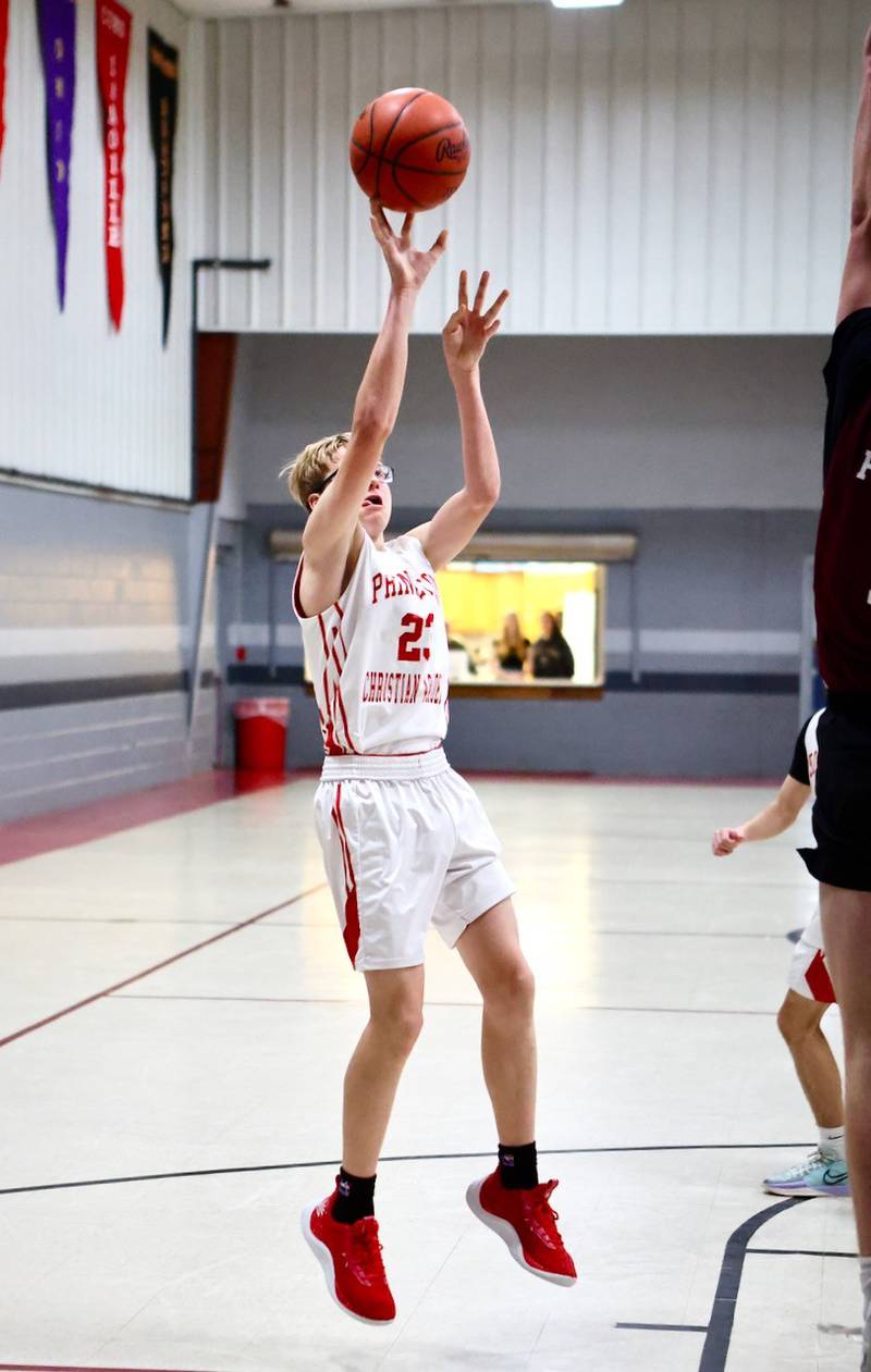 Princeton Christian Academy's Trustin Crew fires a shot in Tuesday's game vs. Ottawa Christian Academy at Howard Hoffman Memorial Gym. The Eagles won 57-42.