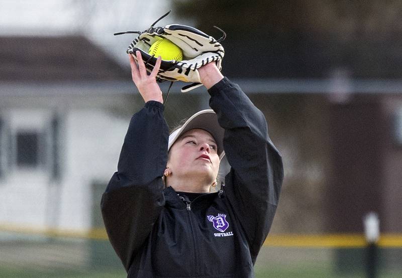 Dixon’s Kennedy Haenitsch squeezes a pop fly against Genoa-Kingston Monday, April 7, 2025.