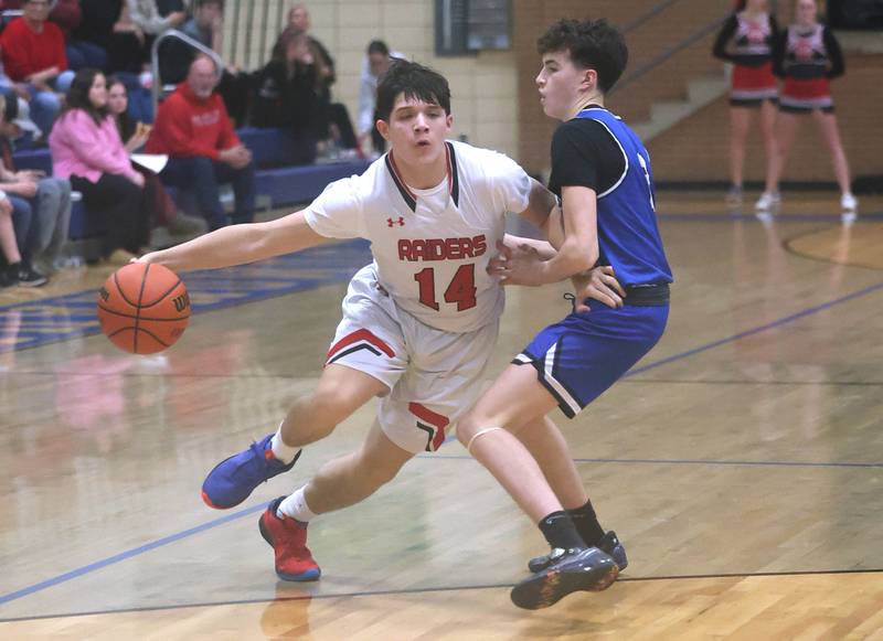 Earlville's Oliver Munoz goes by Hinckley-Big Rock’s Michael Murphy during their game Thursday, Feb. 1, 2024, in the Little 10 boys basketball tournament at Somonauk High School.