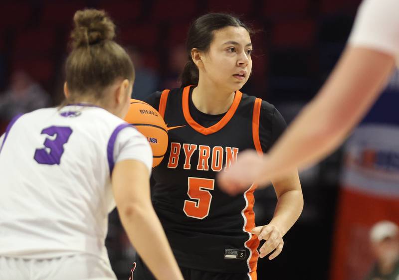 Byron's Ali Muranko looks to pass the ball around Breese Central's Lillian Henrichs during the Class 2A title game on Saturday, March 7, 2026 at CEFCU Arena in Normal.