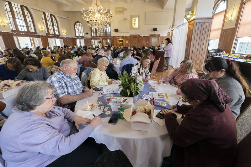 Attendees at the Lee County United Way's campaign luncheon and awards write thank you notes to teachers Thursday, May 1, 2025.