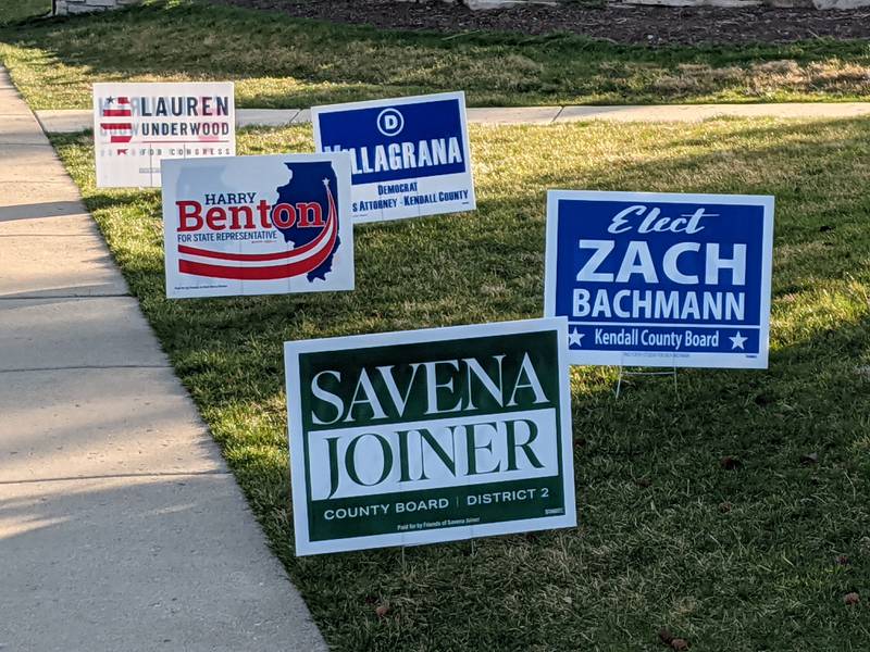 Candidate signs for a variety of races were on display near a polling place in Kendall County Tuesday.
