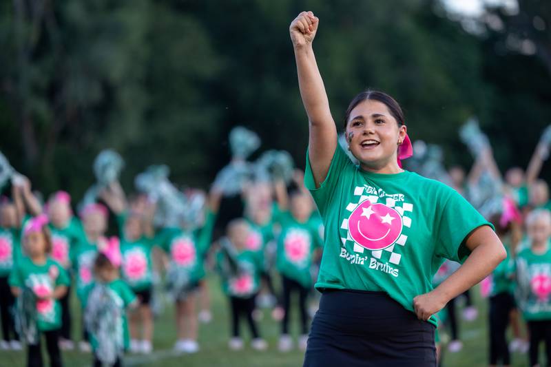 Ella Mudge of St. Bede Cheer Squad entertains crowd before game on Friday, Sept 12, 2025 at Captain Thomas J. Heitmann field in Peru.