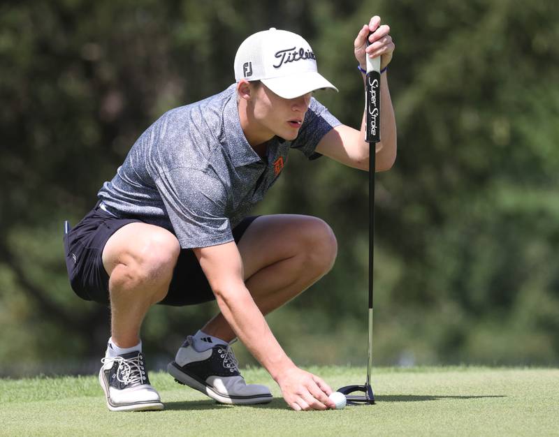 DeKalb’s Tyler Brackemyer lines up his putt on the seventh hole Monday, Aug. 25, 2025, during the Mark Rolfing Cup at the Kishwaukee Country Club in DeKalb.