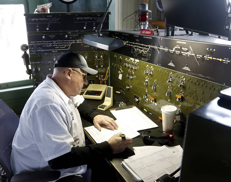 Marcus Ruef checks the schedule as he runs the control tower Saturday, Jan. 21, 2023, as the Illinois Railway Museum celebrates its 70 anniversary with the first of many celebrations by commemorating the 60 years since the abandonment of the Chicago North Shore and Milwaukee Railroad.