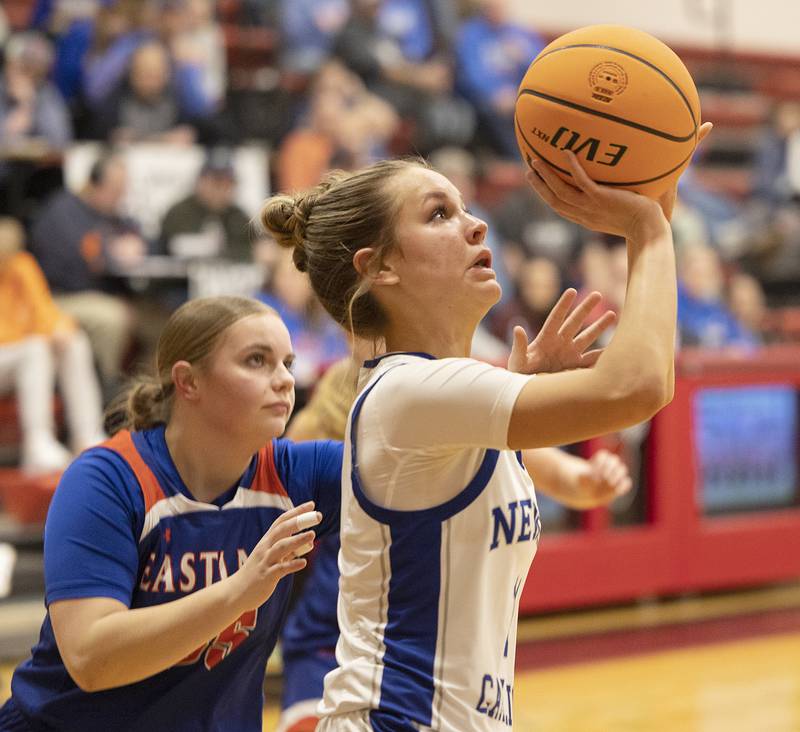 Newman’s Brooklyn Smith puts up a shot against Eastland Tuesday, Feb. 18, 2025, during the Class 1A girls basketball regional at Forreston.