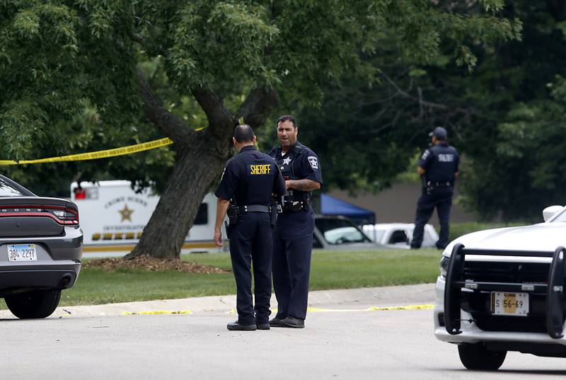 Officers from the McHenry County Sheriff and other departments investigate a domestic incident in which four people were killed on Wednesday Aug. 9, 2023, in the 5800 block of Wild Plum Road in unincorporated Crystal Lake. Police later said they were family members.