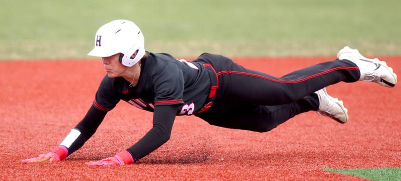 Huntley’s Kyle Larson lands safely as he advances to third base  in varsity baseball at Barrington Saturday.