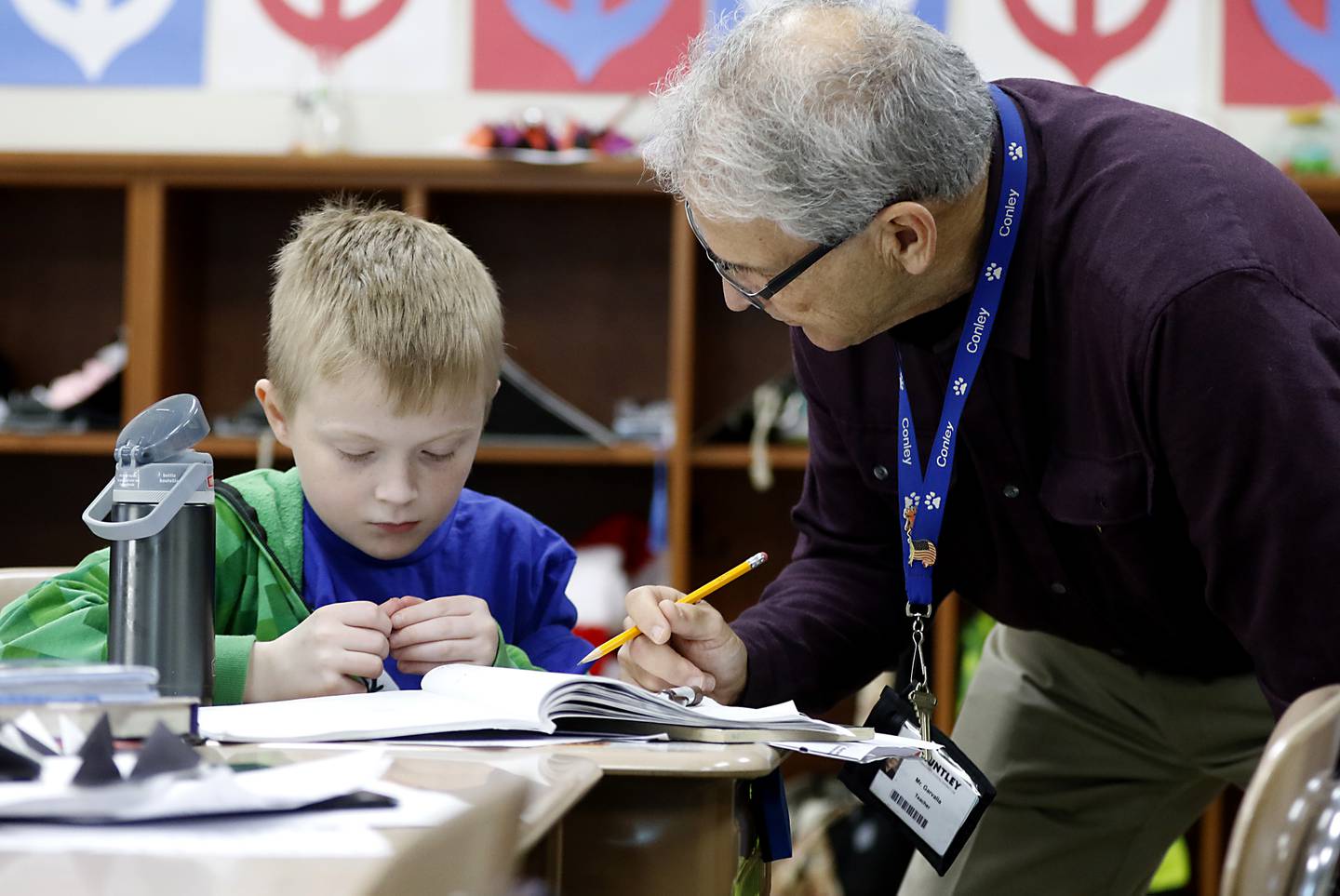 Fifth-grade teacher Jim Garvalia works one-on-one with Declan Jensen as he explains how to solve a math problem Wednesday, Oct, 26, 2022, in the classroom co-taught by Garvalia and Jennifer Hollabaugh at Conley Elementary School, 750 Dr. John Burkey Drive in Algonquin.