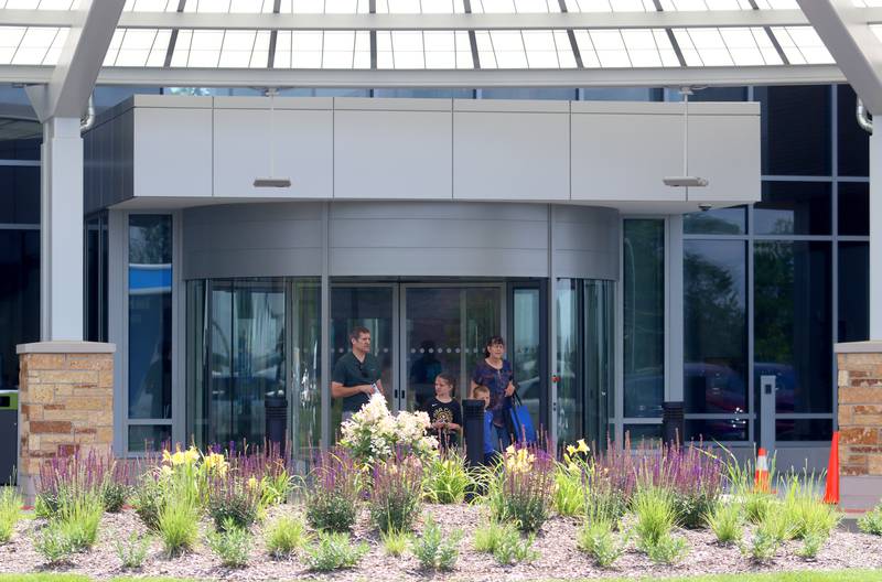 A family checks out the entry during a public open house for the new Mercyhealth hospital in Crystal Lake on Saturday.