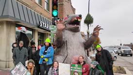 Starbucks’ baristas strike, picket Geneva location with giant rat