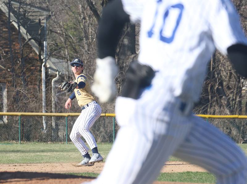 Marquette's Alec Novotney looks to throw out Newark's Toby Steffen at first base on Monday, March 23, 2026 at Newark High School.