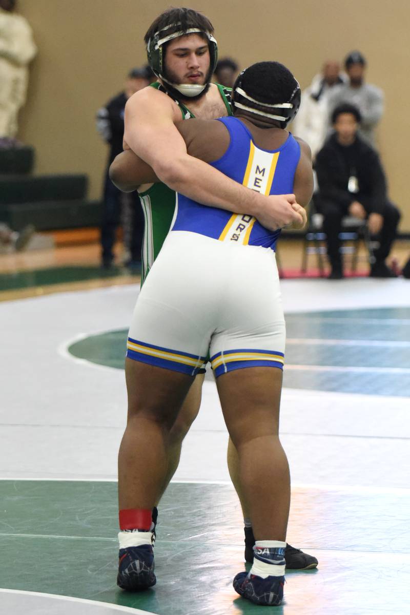 Seneca's Jeremy Gagnon, left, battles De La Salle's David McCarthy during the 285-pound championship match at the IHSA Class 1A Coal City Sectional.