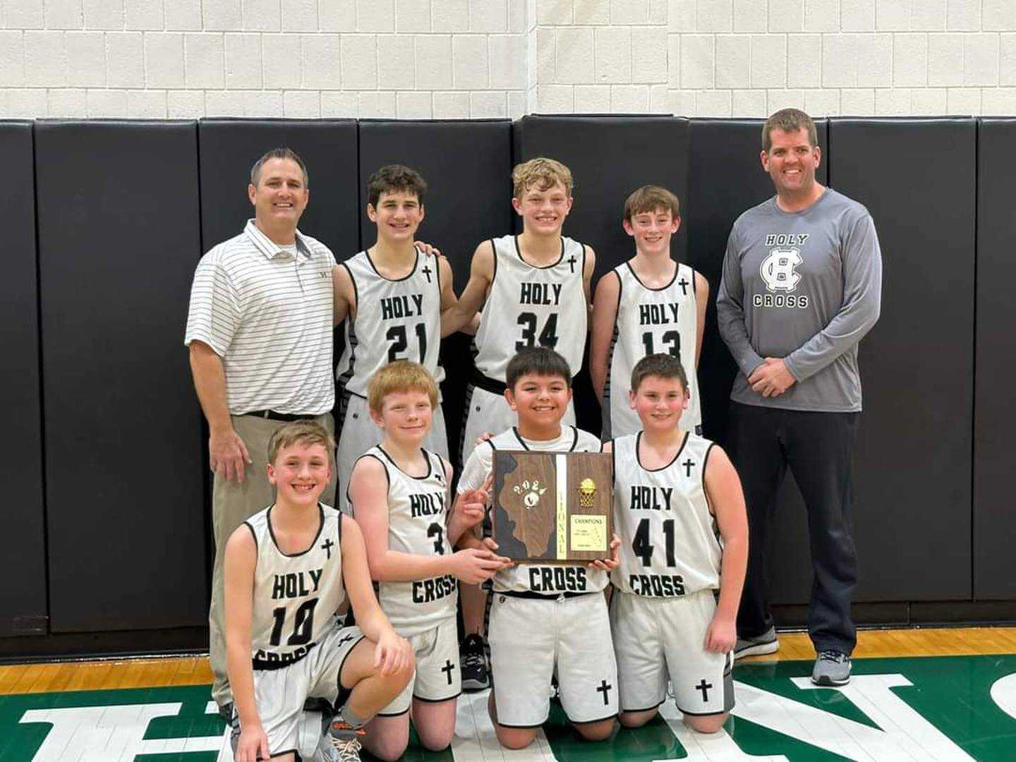 The Mendota Holy Cross seventh grade boys basketball team qualified for the IESA Class 1A state tournament. Pictured, bottom (from left): Camden Pawlowski, Will Aughenbaugh, Rafa Arteaga and Liam Jones. Back: Coach Aaron Eddy, Quinn Eddy, Joe Cackley, Cal Doyle and Coach Luke Tillman.