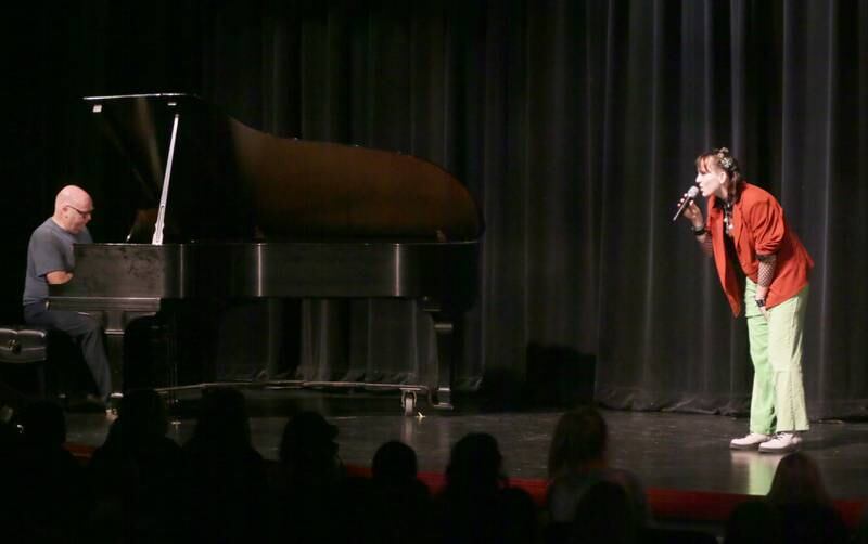 Ottawa Township High School studnet Clara Cartwright sings a solo as subsitute teacher Robin Taylor plays the paino during the 48th annual Fine Arts Festival on Thursday, March 17, 2022 at Ottawa High School.