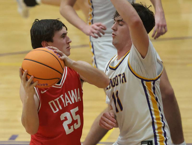 Ottawa's Lucas Farabough works his way in the lane as Mendota's Aiden Tillman defends on Tuesday, Jan. 6, 2026 at Mendota High School.