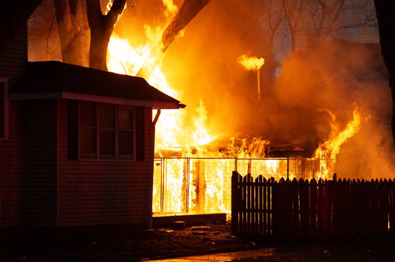 A fire engulfs a garage building at 905 S. Elm Ave in Kankakee after massive hailstones fell during a storm on Tuesday, March 10, 2026. The garage was shelter for several dogs and unclear if all were rescued.