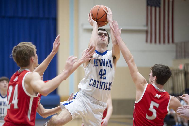 Newman’s Jacob Donald puts a shot up Monday, Feb. 14, 2022 against Newman.