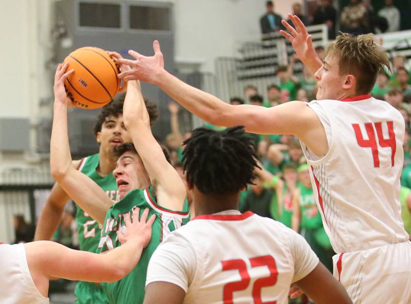 L-P's Nick Olivero grabs a rebound over Streator's Nolan Lukach during the Class 3A Regional title game on Friday, Feb. 28, 2025 in Sellett Gymnasium at L-P High School.