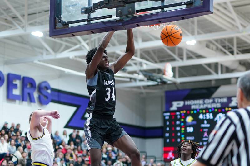 Kaneland’s Jeffrey Hassan (34) dunks the ball against Yorkville Christian during a championship final basketball game in the 61st annual Plano Christmas Classic at Plano High School on Saturday, December 28, 2024.