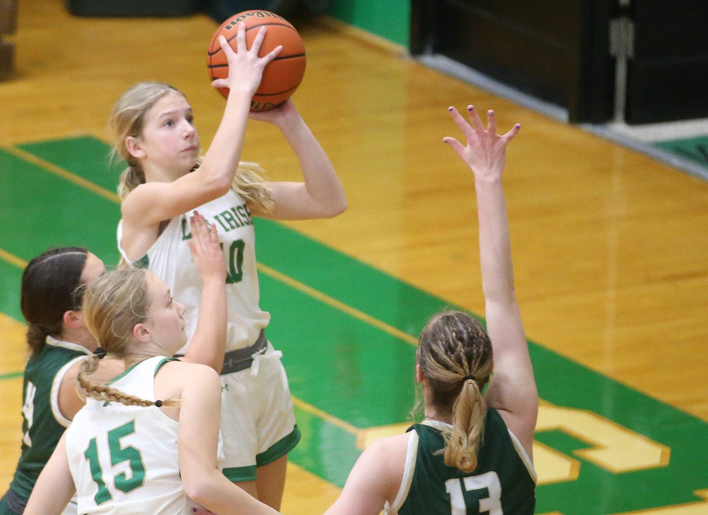 Seneca's Graysen Provance eyes the hoop as St. Bede's Jenna Ladzinski and Ashlyn Ehm defend on Monday, Jan. 29, 2024 at Seneca High School.