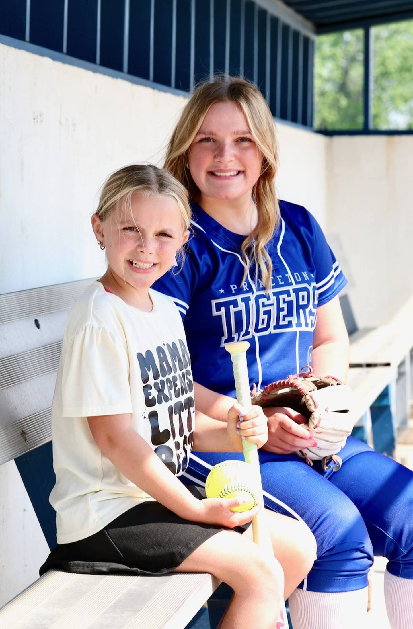 Princeton sophomore Avah Oertel, the 2025 BCR Softball Player of the Year, and her best friend, her little sister Olivia team up in the Tigresses dugout.