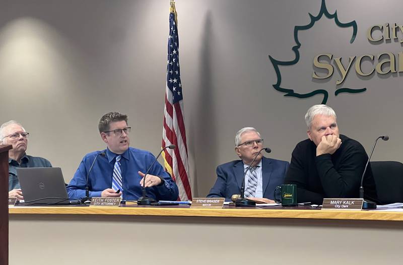 Second Ward Alderman Chuck Stowe, left, Sycamore Attorney Keith Foster, center right, and Sycamore Mayor Steve Braser, right, listens as Sycamore City Manager Michael Hall, center left, discusses property taxes during the Nov. 20, 2023 Sycamore City Council meeting.