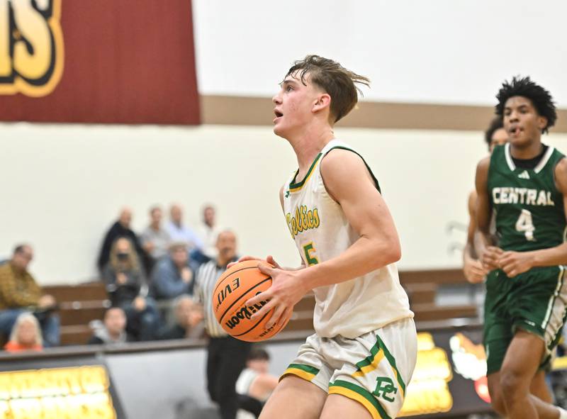 Providence Catholic's Eli Phillips (5) drives to the basket during the WJOL tournament game against Plainfield Central on Friday, NOV. 28, 2025, at Joliet.