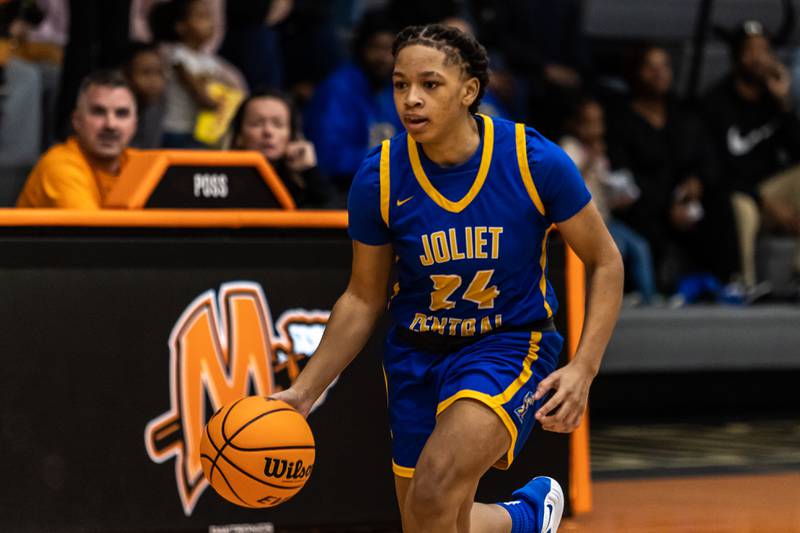 Joliet Central's Malasia Chandler dribbles down court during a WJOL Girls Basketball Tournament game against Minooka at Minooka on Nov. 19, 2025